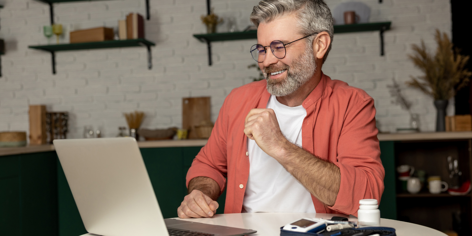 A person checking his glucose levels while on a telehealth appointment.