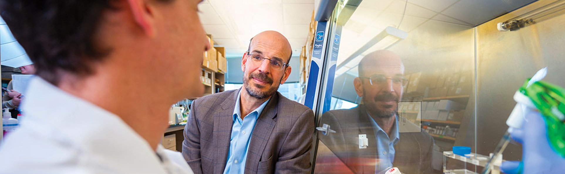 Terry Fry talks to research in the lab