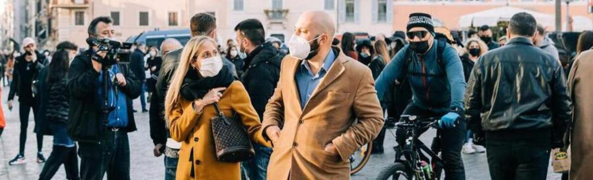 Man and woman wearing masks walking together
