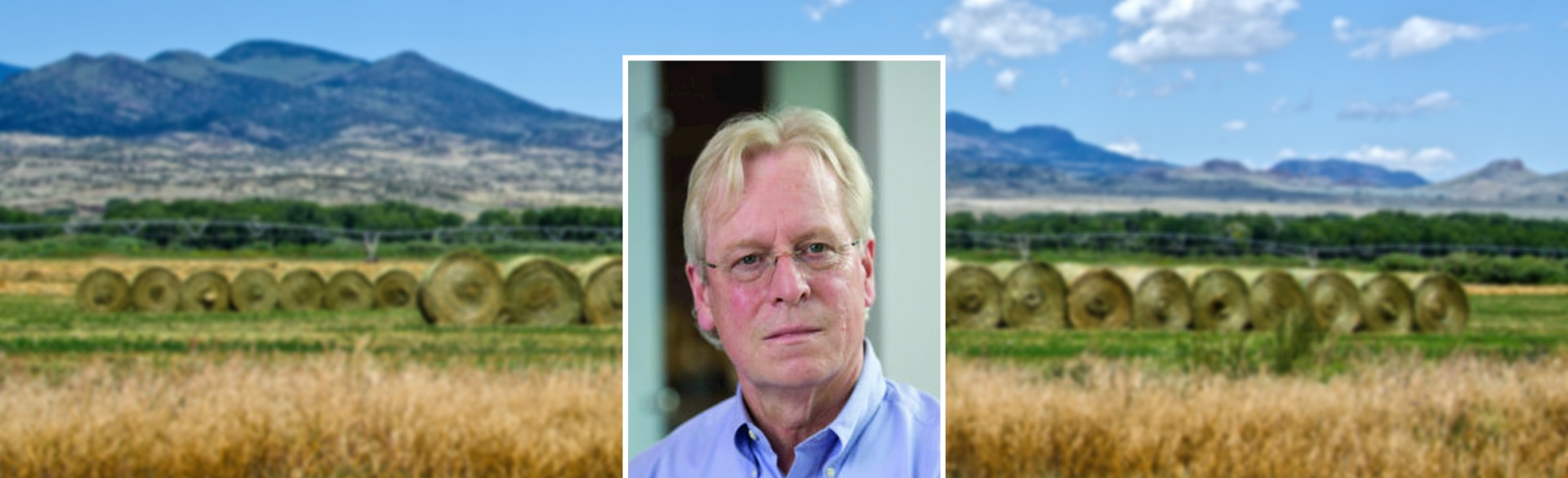 Headshot of man on background of Colorado mountains