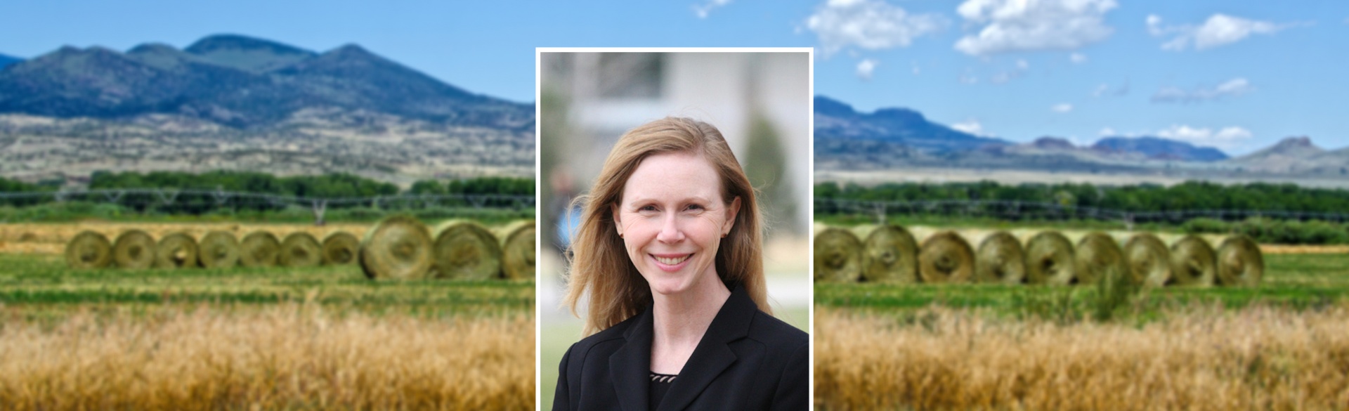 Woman smiling in headshot on background of Colorado mountains