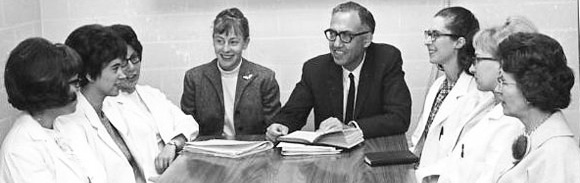 Pioneers of nurse practitioner program sit around table