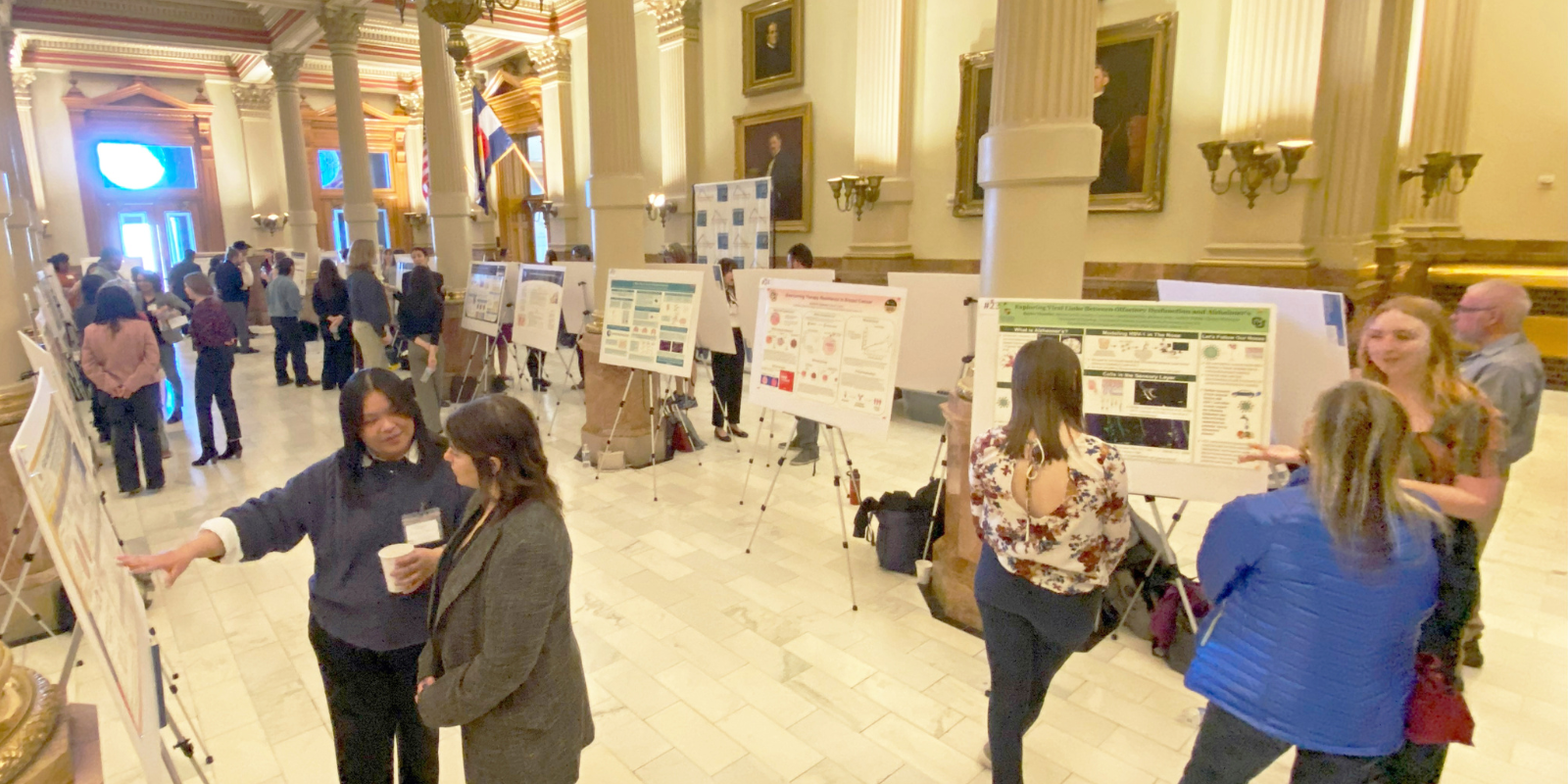 Photo at top: Presenters and visitors gather in the West Foyer of the Colorado State Capitol for STEM Poster Day at the Capitol on March 11, 2025.