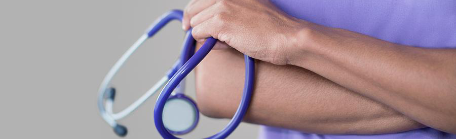 Close-up of hand holding purple stethoscope