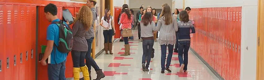adolescent students in a school hallway