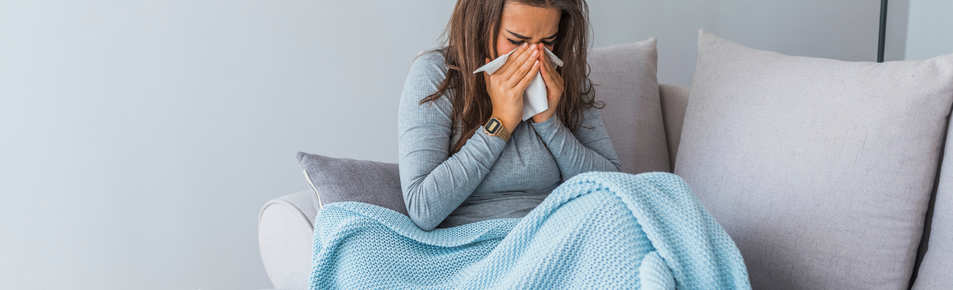 woman blowing her nose